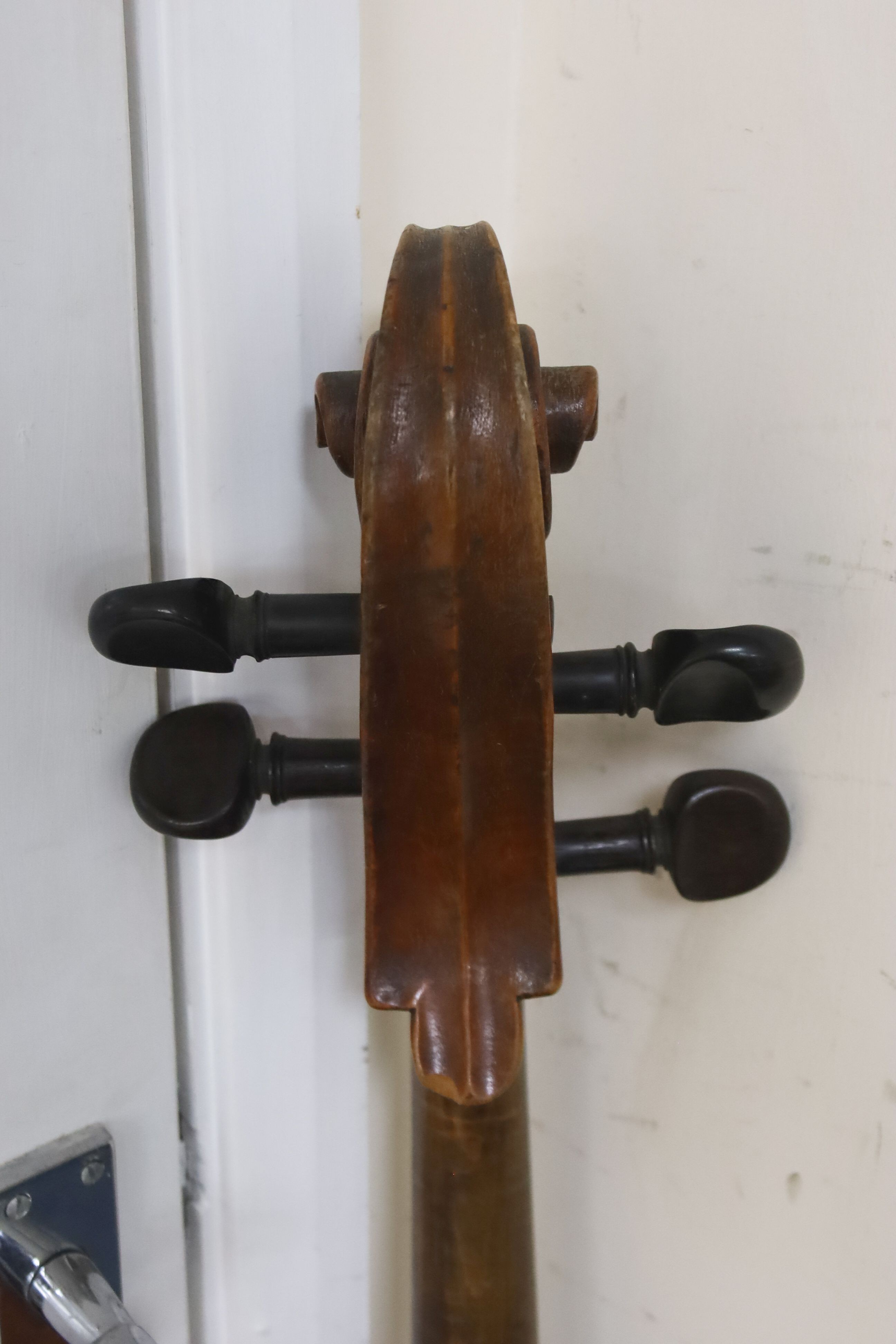 Early 20th century German cello and bow, the back measuring 75cm excluding the button